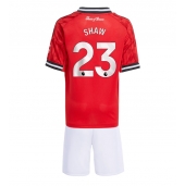 Maillot de football Réplique Manchester United Luke Shaw #23 Domicile Enfant 2025-26 Manche Courte (+ Pantalon court)